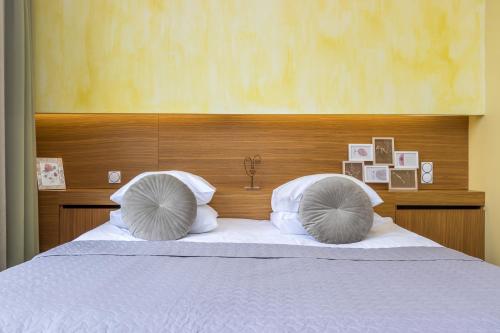 A bed or beds in a room at Bern Boutique Hotel