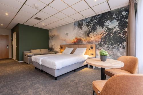 Cama ou camas em um quarto em Fletcher Hotel-Restaurant Langewold