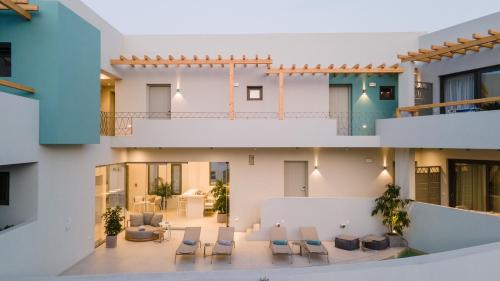 an internal view of a building with chairs and tables at Anapollo Boutique Hotel Adults Only in Naxos Chora