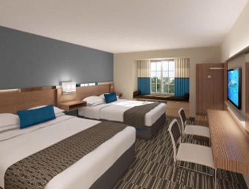 Krevet ili kreveti u jedinici u okviru objekta Microtel Inn & Suites by Wyndham Altoona