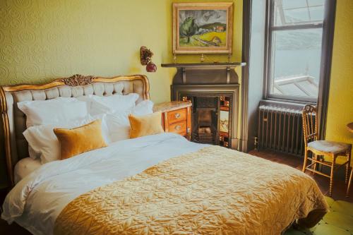 A bed or beds in a room at Ardrhu House Fort William - Serviced Luxury Scots Baronial Country House