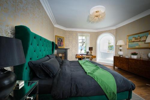 A bed or beds in a room at Ardrhu House Fort William - Serviced Luxury Scots Baronial Country House