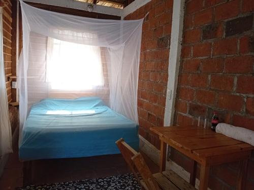 A bed or beds in a room at hostal pakal