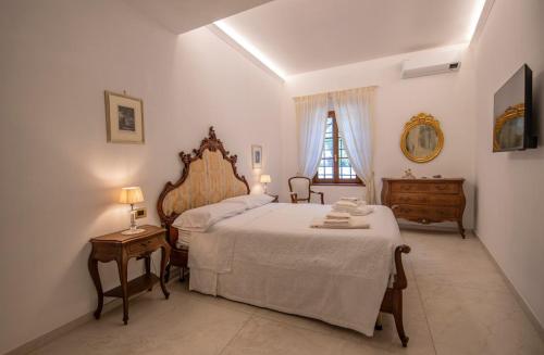 a bedroom with two beds and a window at Casa di Anna in Pistoia