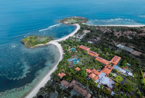 an aerial view of a beach next to the ocean at Meliá Bali in Nusa Dua