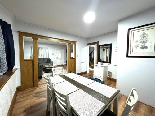 a kitchen and dining room with a table and chairs at Getaway at Falls-3 Beds-Slips 6 in Niagara Falls