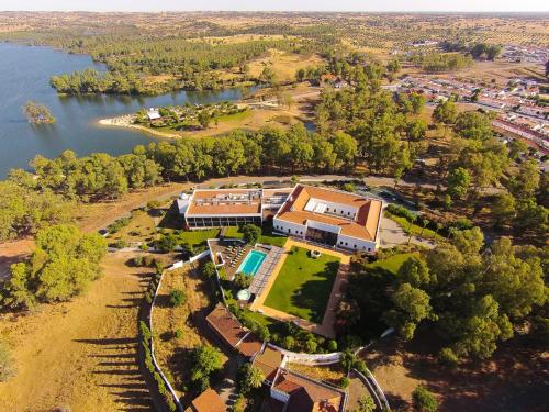 an aerial view of a house next to a lake at Alentejo Star Hotel - Sao Domingos - Mertola - Duna Parque Resorts & Hotels in Mina de São Domingos