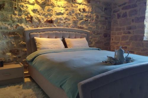 Tempat tidur dalam kamar di Το Αρχοντικό του Νικόλα