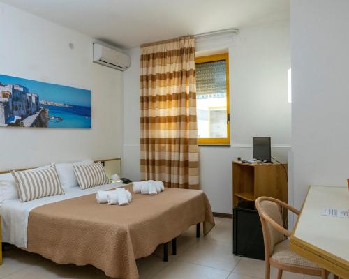 Voodi või voodid majutusasutuse Hotel Santa Lucia toas