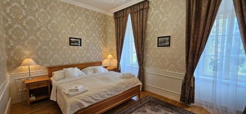 Zamecky Hotel Lednice tesisinde bir odada yatak veya yataklar