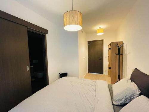 Cama ou camas em um quarto em T & B Trianon - Appartement Chic & Cosy