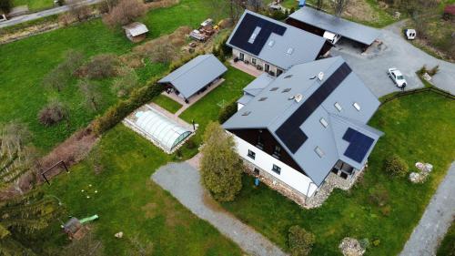 an overhead view of a large house with a garage at Apartmány Vízmberk in Velké Losiny