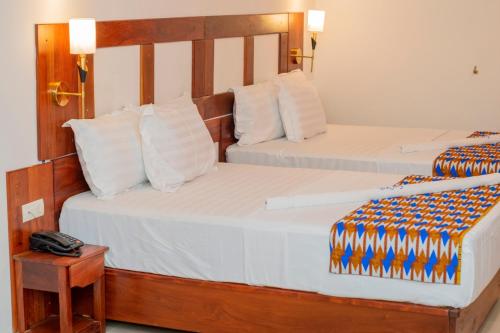 Krevet ili kreveti u jedinici u objektu Hotel BKBG Benin