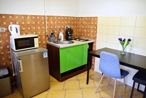 A cozinha ou cozinha compacta de Makotel Apartmanház