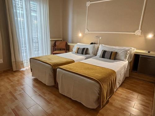 Ліжко або ліжка в номері Hotel Celimar