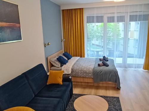 Tempat tidur dalam kamar di Apartament Centrum Białystok