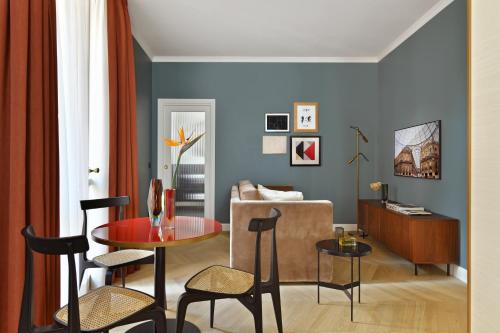 a living room with a table and a couch at Casa Brivio in Milan