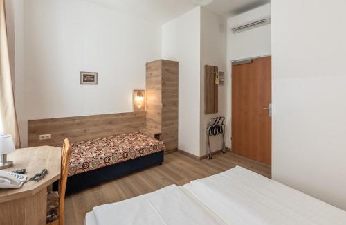 Una cama o camas en una habitación de Hotel Terminus