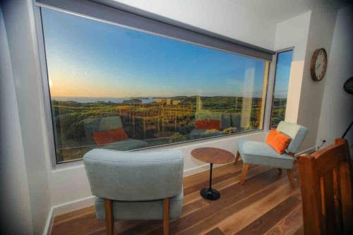 a living room with a large window with a view at Martyrs Lookout - Luxury Accommodation in Peterborough