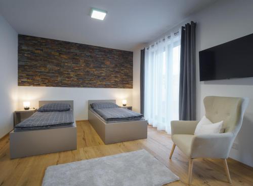 Uma área de estar em Apartments Poděbradova Premium