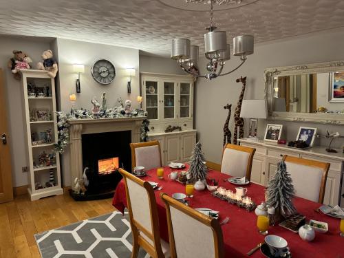 a dining room with a table with christmas decorations at Seacrest in Galway