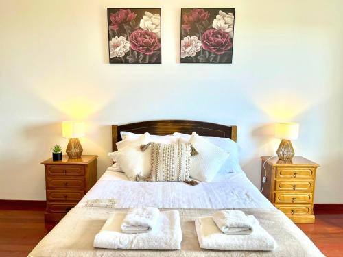 a bedroom with a bed with two towels on it at Villa Garden Santana by Your Key in Santana