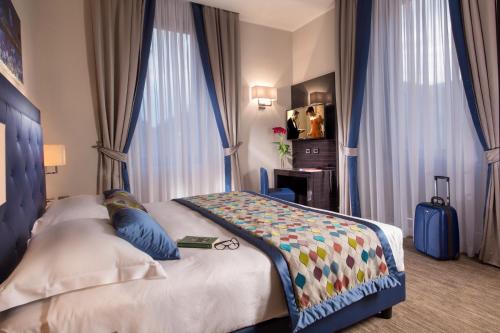 Uma cama ou camas num quarto em Gioberti Art Hotel