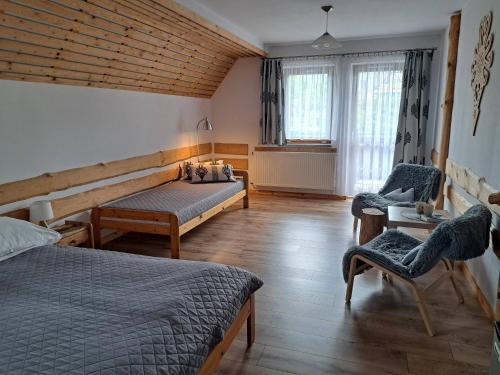 Llit o llits en una habitació de Przy Szlaku Zakopane centrum pokoje & apartamenty