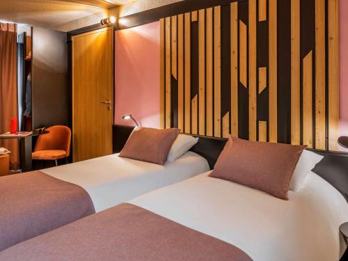 Giường trong phòng chung tại ibis Styles Boulogne sur Mer Centre Cathédrale