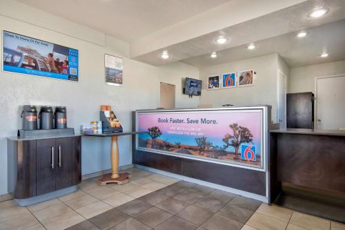 a waiting room with a large aquarium in a store at Motel 6-Albuquerque, NM - Carlisle in Albuquerque