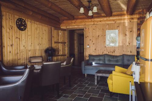 a living room with a couch and chairs at Vila Termal in Veľký Meder