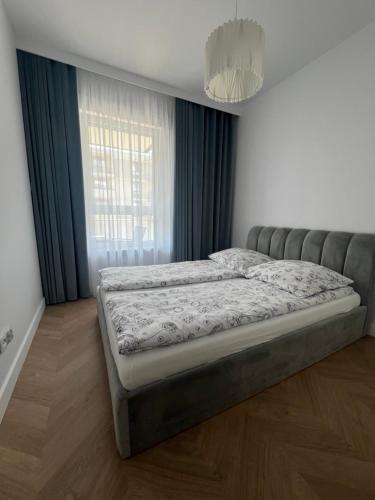 Vuode tai vuoteita majoituspaikassa Tani Nocleg Ełk - Apartament I love Ełk