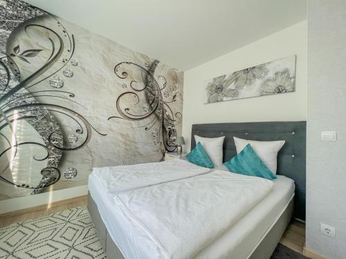 A bed or beds in a room at Relax Prémium Wellness Apartman