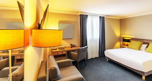 เตียงในห้องที่ Best Western Hotel Atrium Valence