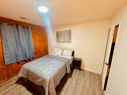 A bed or beds in a room at Cozy Muncie Home Near Downtown