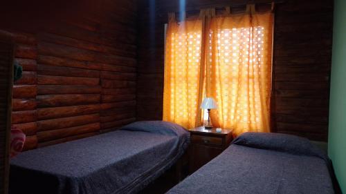 Tempat tidur dalam kamar di Cabaña 2 Don Pepe