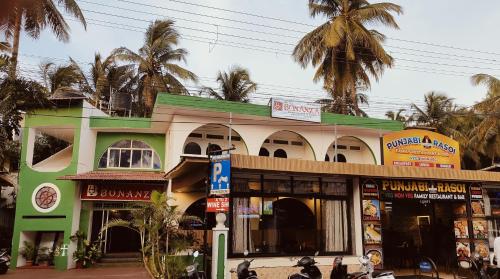 a building with motorcycles parked in front of it at Hotel Bonanza in Baga