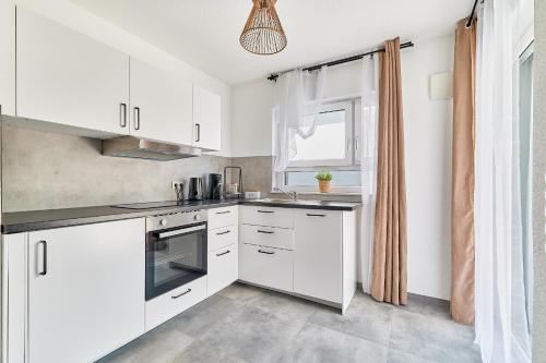 Kuhinja oz. manjša kuhinja v nastanitvi Elegantes 2 Zimmer Apartment Neubau Top Lage