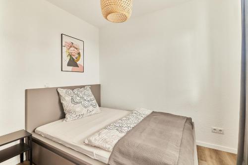 Elegantes 1 Zimmer Apartment Neubau Top Lage房間的床