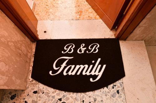 a sign that says b b family on the floor at B&B Family in Torre del Greco