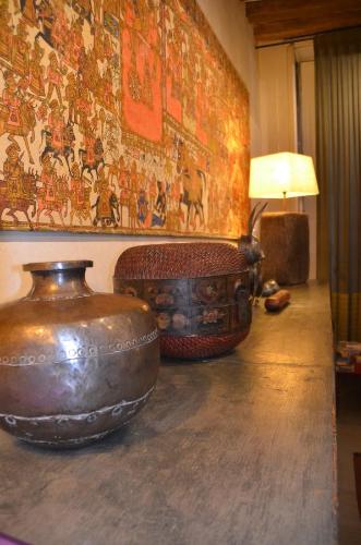 two vases sitting on a table in a room at La Maison d'Anne in Paris