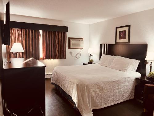 Posteľ alebo postele v izbe v ubytovaní Travelodge by Wyndham Valleyfair Shakopee