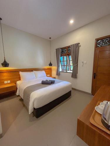 Krevet ili kreveti u jedinici u objektu Kaman Bali Guesthouse