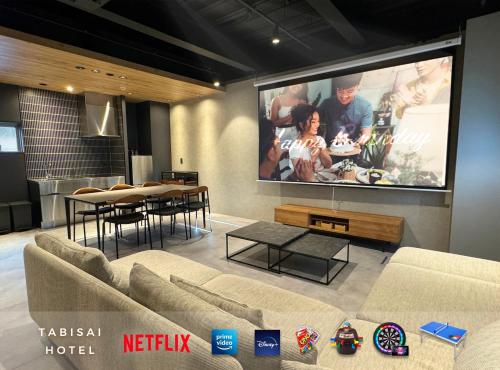 A television and/or entertainment centre at TABISAI HOTEL Lunon Tenjin