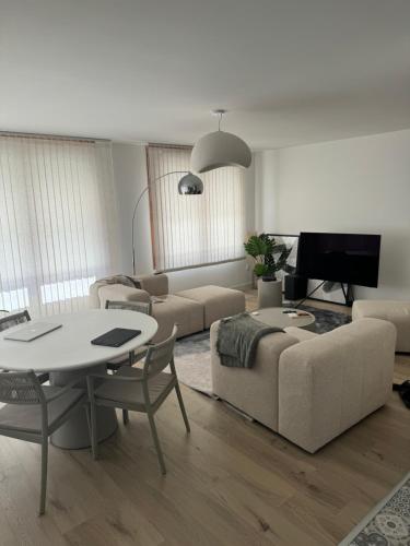 Zona d'estar a Appartement Cosy, proche Stade de France