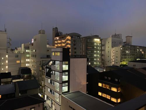 a view of a city at night with buildings at A-Style Matsu 602 in Osaka