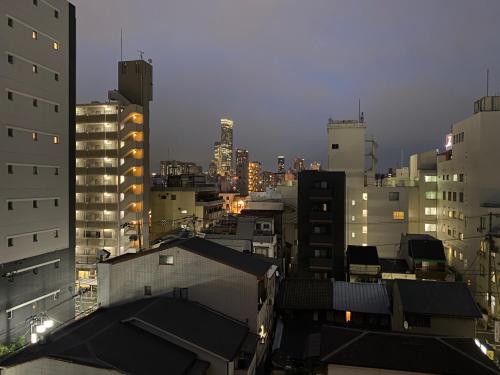 a view of a city at night with buildings at A-Style Matsu 602 in Osaka