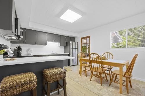 a kitchen and dining room with a table and chairs at Sunrise - 1322 Indian Point Road in Branson