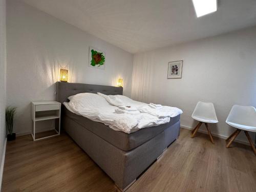 เตียงในห้องที่ Premium Apartments Schwetzingen, Heidelberg, Speyer