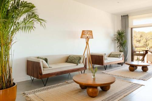 a living room with a couch and a table at Victoria Sunset Suites in San Antonio